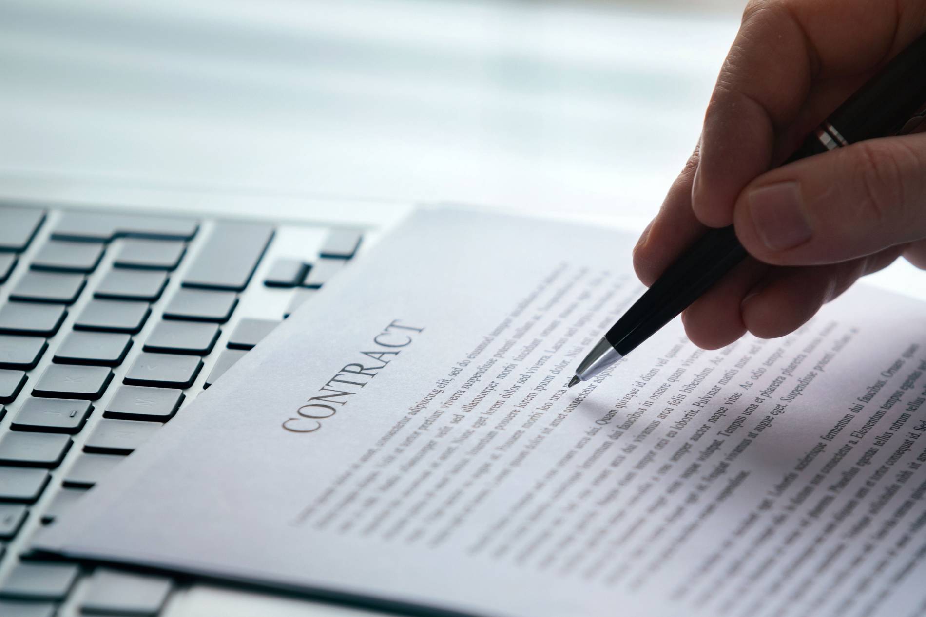 contract-reading-legal-advice-business-agreement-printed-document-hand-with-pen-concept_1900x1267