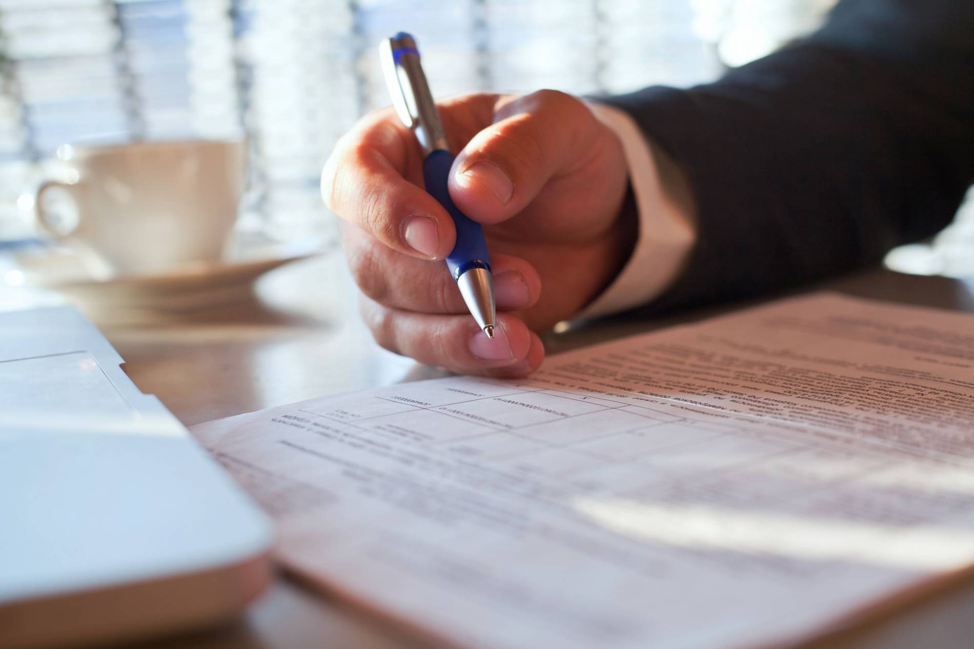 legal-advice-from-lawyer-notary-compliance-verification-contract-conditions-close-up-hand-with-pen-document_1900x1267