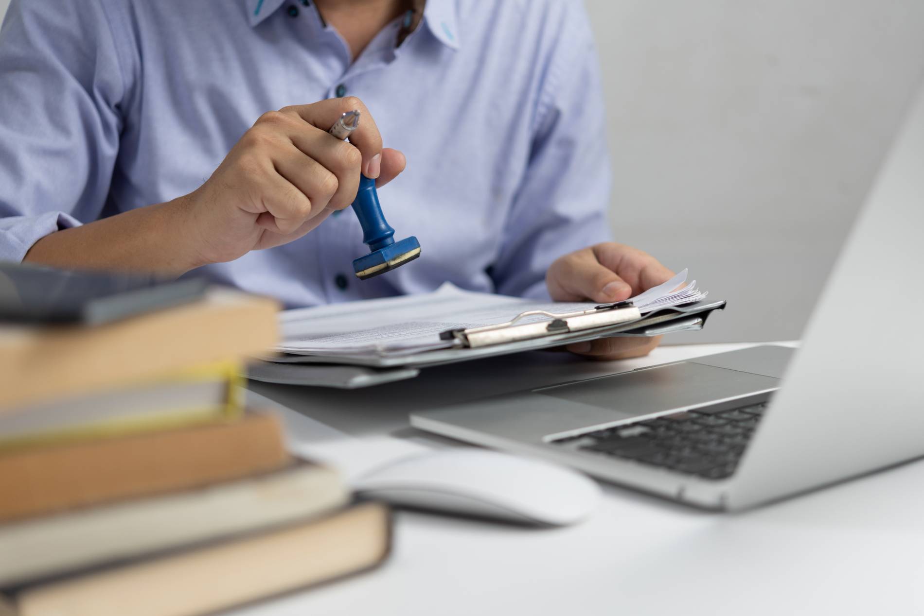 man-stamping-approval-work-finance-banking-investment-marketing-documents-desk_1900x1268